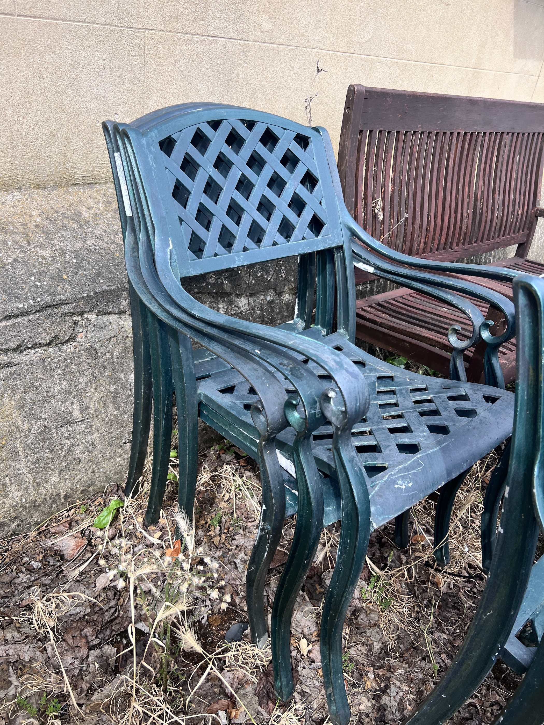 A set of six painted aluminium stacking garden elbow chairs